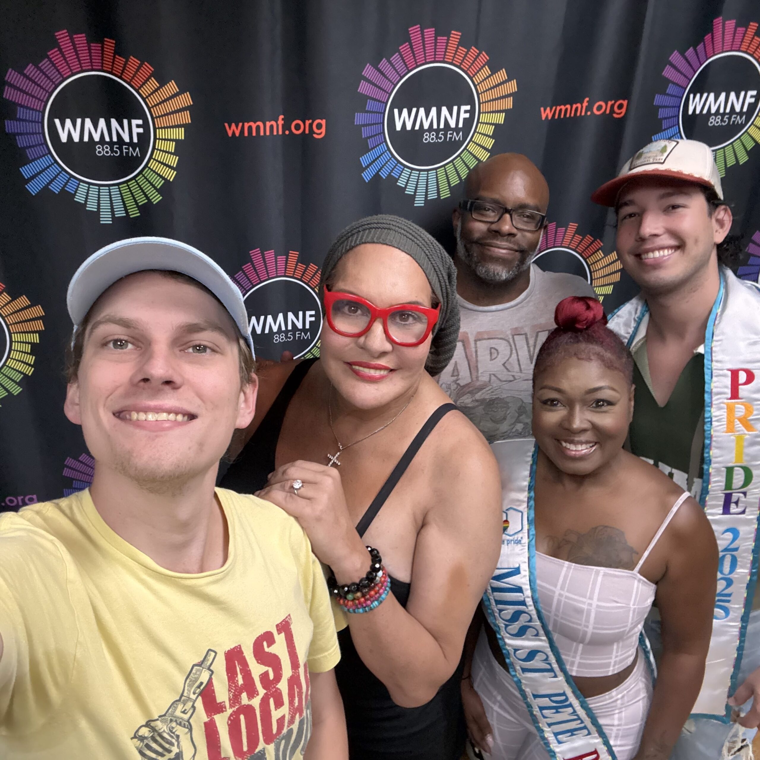 Photo by Chris Gorman at the WMNF Studio's, June 24th, 2025 - Big Gay Radio Show host Chris Gorman, Esme Russel, and Bryan Hinkson, joined by the 2025 Mx. St. Pete Pride Royal Court.