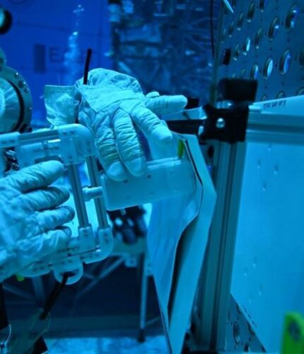 A NASA diver performs an underwater test of a tool designed by Florida Polytechnic University students to be potentially used for repairs outside the International Space Station. Image courtesy of NASA